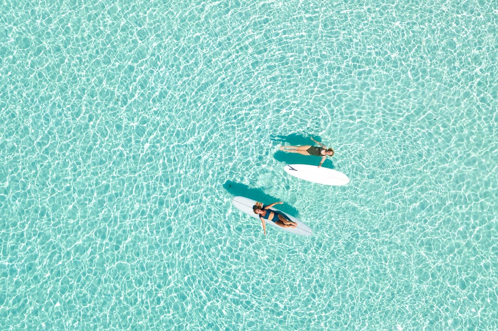 Two Women on Paddle Board in Blue Ocean2