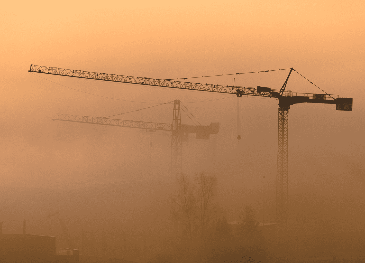 construction cranes in dust